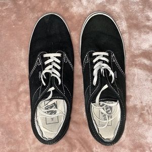 Black Vans sneakers